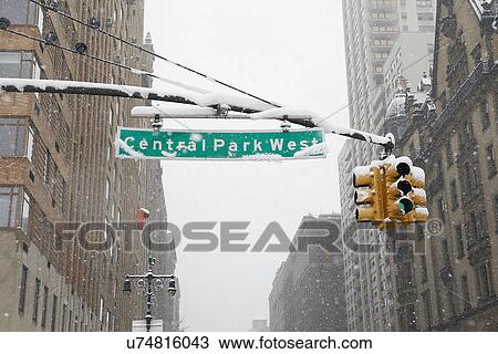 Stock Image - Directional sign with Dakota Apartment Building in background. Fotosearch