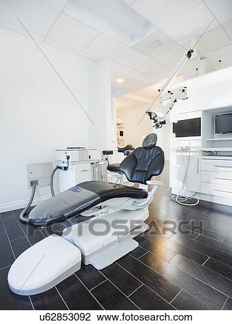 Stock Image - Empty dentist's office with modern equipment. Fotosearch