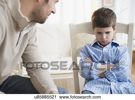Father looking at displeased son (8-9) View Large Photo Image Stock Image - Father looking at displeased son (8-9) . Fotosearch