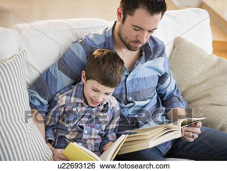 Father reading books with his son (8-9) View Large Photo Image Stock Photograph - Father reading books with his son (8-9). Fotosearch