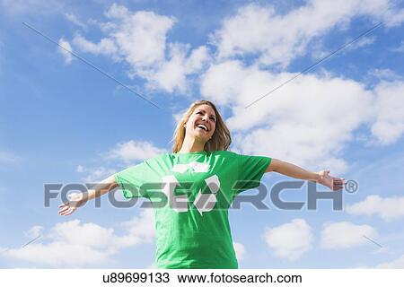 Stock Image - Front view of woman wearing green t-shirt. Fotosearch