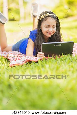 girl ( 8-9) using digital tablet View Large Photo Image Stock Image - girl ( 8-9) using digital tablet. Fotosearch
