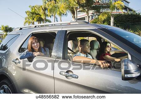 Happy people in car View Large Photo Image Stock Image - Happy people in car. Fotosearch