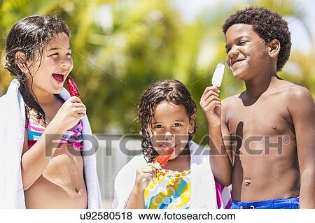 Stock Photo - Kids( 4-5, 6-7, 8-9) eating ice-creams. Fotosearch