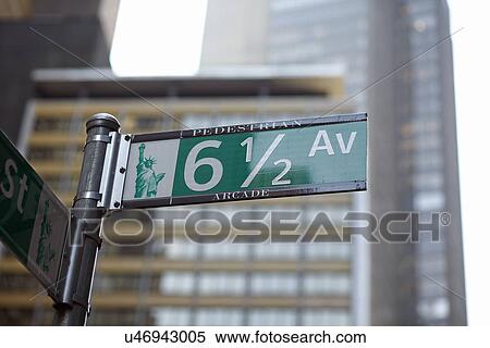 Low angle view of street name sign View Large Photo Image Stock Photography - Low angle view of street name sign . Fotosearch