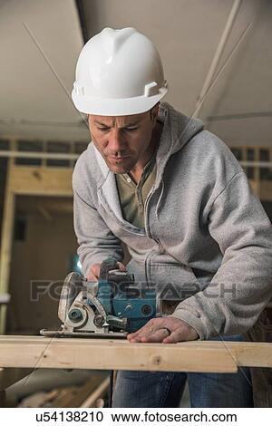 Lumber at work on new structure View Large Photo Image Stock Image - Lumber at work on new structure. Fotosearch