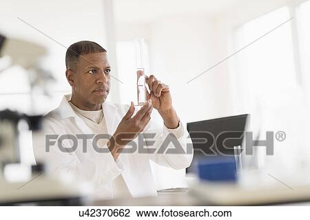 Male technician working in laboratory View Large Photo Image Stock Image - Male technician working in laboratory. Fotosearch