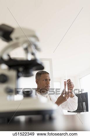 Stock Photo - Male technician working in laboratory. Fotosearch