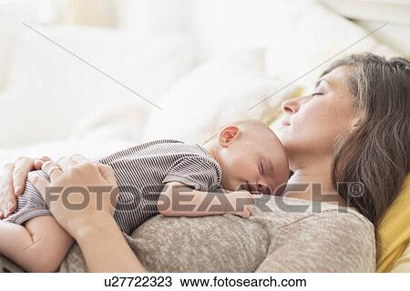 Mother with baby boy (2-5 months) taking nap together View Large Photo Image Stock Image - Mother with baby boy (2-5 months) taking nap together. Fotosearch