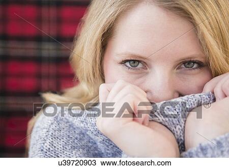 Portrait of blond woman wearing ssweater View Large Photo Image Stock Image - Portrait of blond woman wearing ssweater. Fotosearch