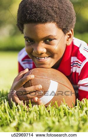 Picture - Portrait of boy (6-7) with ball. Fotosearch