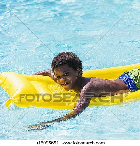 Portrait of boy ( 6-7) with pool raft View Large Photo Image Stock Image - Portrait of boy ( 6-7) with pool raft. Fotosearch