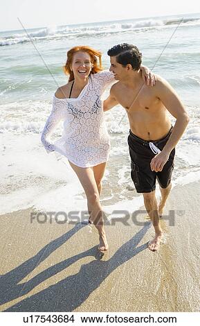Picture - Portrait of couple on beach. Fotosearch