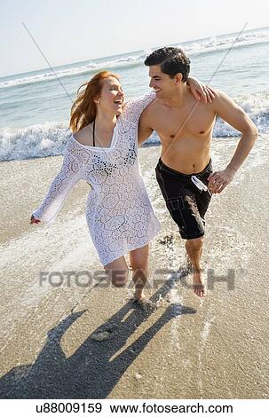 Portrait of couple on beach View Large Photo Image Stock Photo - Portrait of couple on beach. Fotosearch