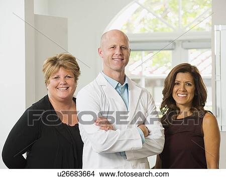 Portrait of dentist and assistants View Large Photo Image Picture - Portrait of dentist and assistants. Fotosearch