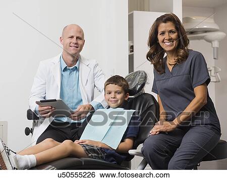 Portrait of dentist, patient( 12-13) and assistant View Large Photo Image Stock Photograph - Portrait of dentist, patient( 12-13) and assistant. Fotosearch