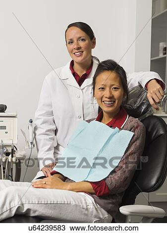 Portrait of dentist with patient View Large Photo Image Stock Image - Portrait of dentist with patient. Fotosearch