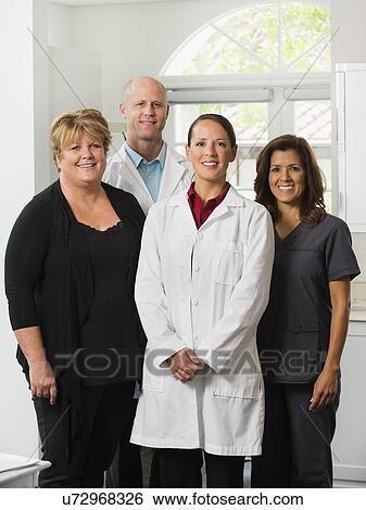Stock Photograph - Portrait of dentists and assistants. Fotosearch