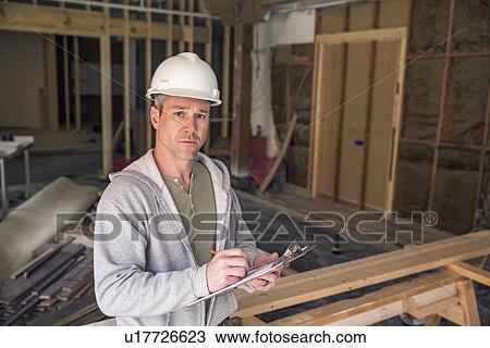Stock Image - Portrait of engineer at work on new structure. Fotosearch