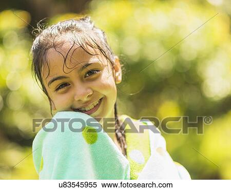 Stock Photography - Portrait of girl (8-9) with wet hair. Fotosearch