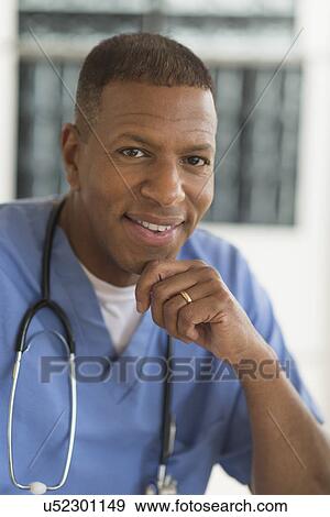 Portrait of male doctor in hospital View Large Photo Image Stock Photo - Portrait of male doctor in hospital. Fotosearch