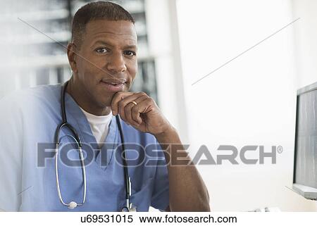 Stock Photography - Portrait of male doctor in hospital. Fotosearch