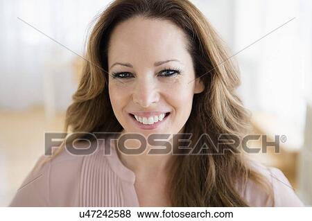 Stock Photo - Portrait of smiling mature woman. Fotosearch