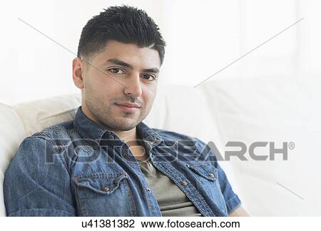 Stock Image - Portrait of smiling young man. Fotosearch