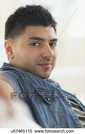 Stock Image - Portrait of smiling young man. Fotosearch