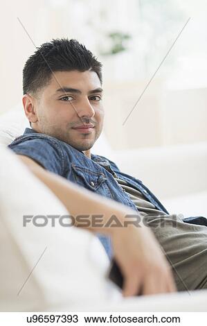 Portrait of smiling young man View Large Photo Image Stock Image - Portrait of smiling young man. Fotosearch