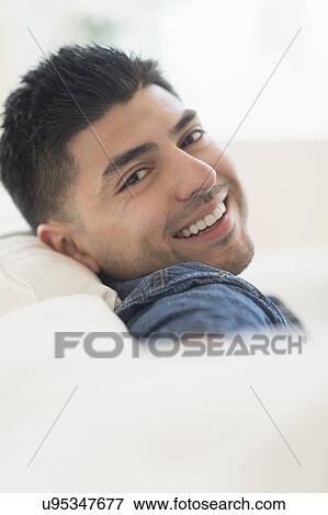 Portrait of smiling young man View Large Photo Image Stock Photo - Portrait of smiling young man. Fotosearch