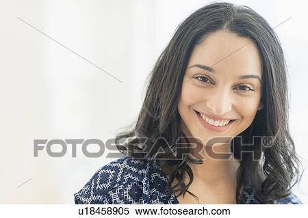 Stock Photography - Portrait of smiling young woman . Fotosearch