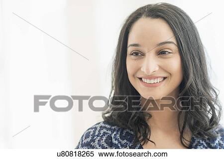 Stock Photography - Portrait of smiling young woman . Fotosearch