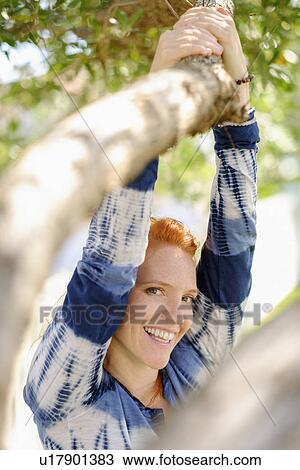 Portrait of woman holding branch View Large Photo Image Stock Image - Portrait of woman holding branch. Fotosearch