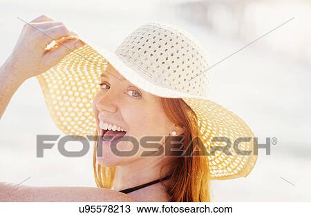 Portrait of woman wearing sun hat View Large Photo Image Stock Image - Portrait of woman wearing sun hat. Fotosearch