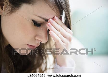 Stock Photo - Portrait of young tired woman . Fotosearch