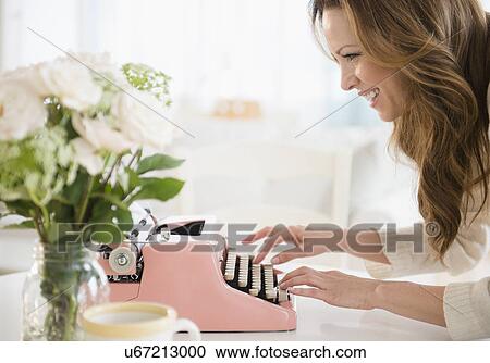 Profile of woman typewriting View Large Photo Image Stock Image - Profile of woman typewriting. Fotosearch