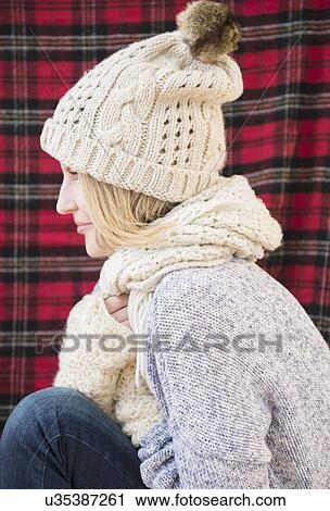 Profile of woman wearing knit hat and scarf View Large Photo Image Stock Image - Profile of woman wearing knit hat and scarf. Fotosearch