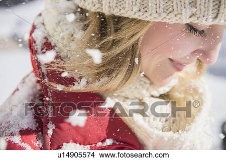 Picture - Profile of woman wearing knit hat in winter. Fotosearch