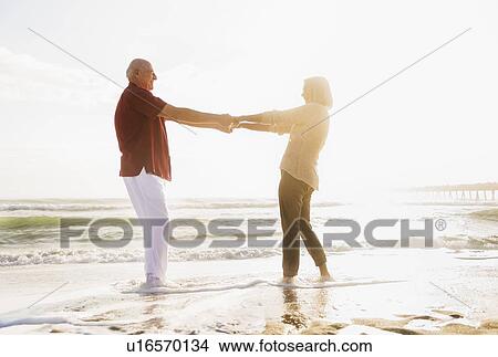 Senior couple dancing on beach View Large Photo Image Picture - Senior couple dancing on beach. Fotosearch