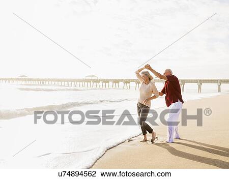 Senior couple dancing on beach View Large Photo Image Stock Image - Senior couple dancing on beach. Fotosearch