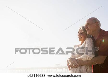 Senior couple embracing on beach View Large Photo Image Stock Image - Senior couple embracing on beach. Fotosearch