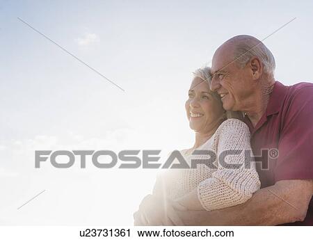 Stock Image - Senior couple embracing. Fotosearch