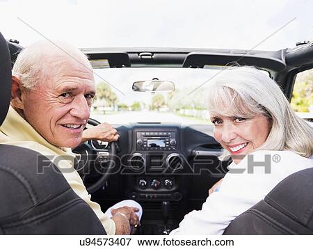 Stock Photo - Senior couple in convertible car. Fotosearch