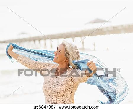 Senior woman on beach View Large Photo Image Stock Photo - Senior woman on beach. Fotosearch