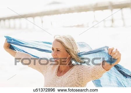 Senior woman on beach View Large Photo Image Stock Photograph - Senior woman on beach. Fotosearch