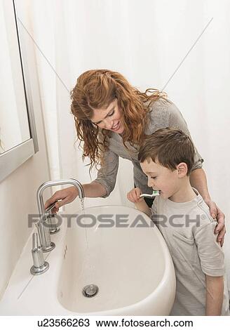 son (6-7) and mother brushing teeth View Large Photo Image Stock Image - son (6-7) and mother brushing teeth. Fotosearch