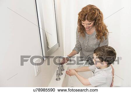 son (6-7) and mother washing hands View Large Photo Image Stock Image - son (6-7) and mother washing hands. Fotosearch