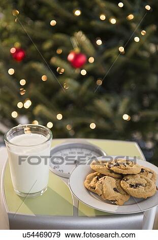 Studio Shot of cookies and milk on bathroom scale View Large Photo Image Stock Photo - Studio Shot of cookies and milk on bathroom scale. Fotosearch