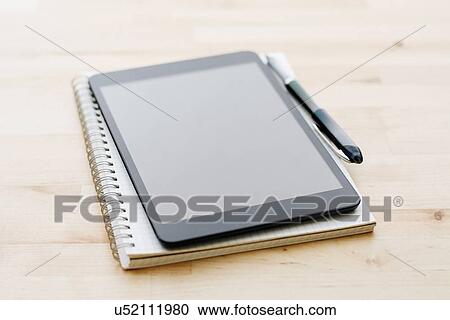 Studio shot of digital tablet, Spiral notebook and ballpoint pen View Large Photo Image Stock Image - Studio shot of digital tablet, Spiral notebook and ballpoint pen. Fotosearch